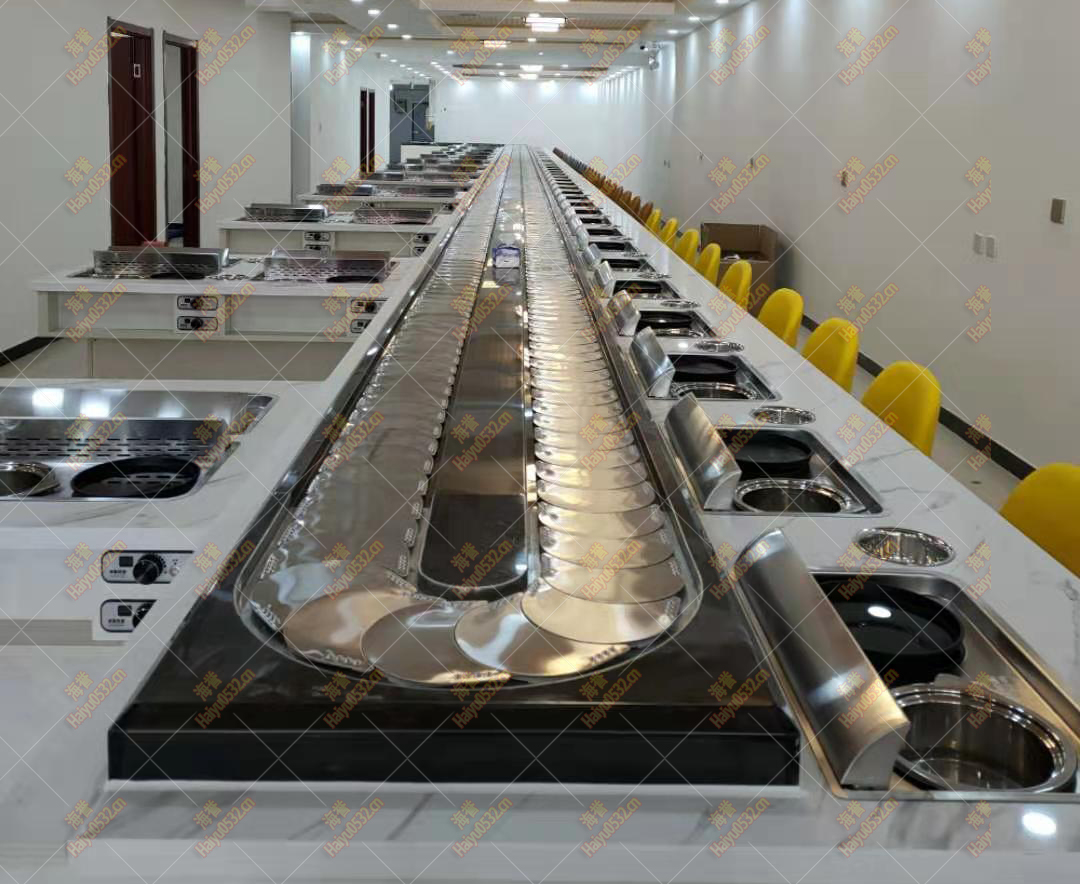 超長直線無煙四人桌旋轉(zhuǎn)小火鍋設(shè)備完工